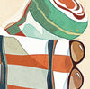 Beach bag filled with towel, sunglasses, and sun hat on the sand with ocean in the background, coastal lifestyle art print displayed in detail