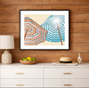 Colorful beach umbrellas viewed from below against a bright blue sky, coastal art print displayed in a light beach house interior