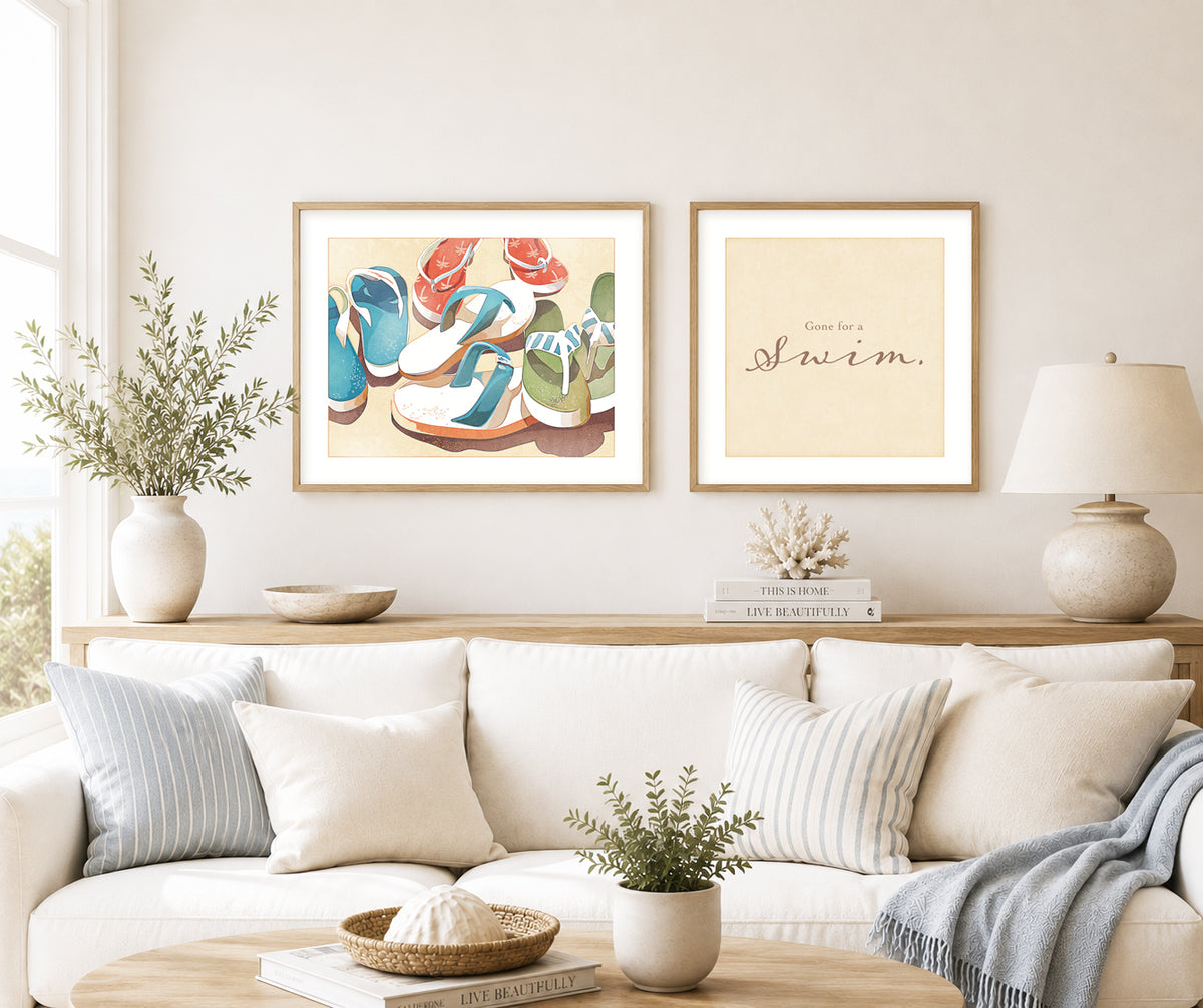 Gallery wall featuring the "Gone for a Swim" sandals wall art print paired with the "Gone for a Swim" typography print in a bright coastal interior.